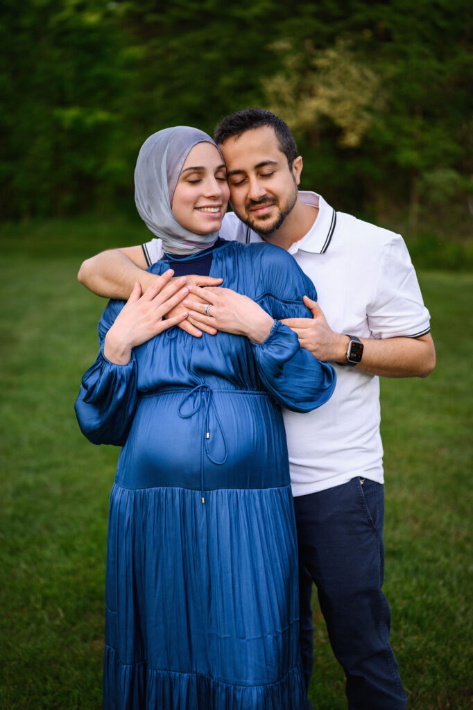 Mom and Dad to bee snuggling during their Grand Rapids maternity session