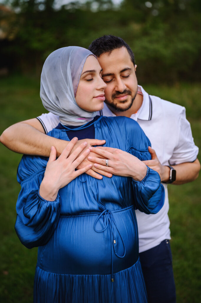 Mom and Dad to bee snuggling during their Grand Rapids maternity session