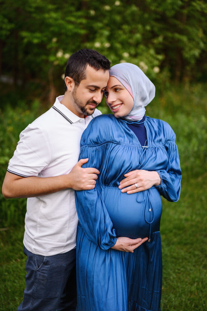 Mom and Dad to bee snuggling during their Grand Rapids maternity session