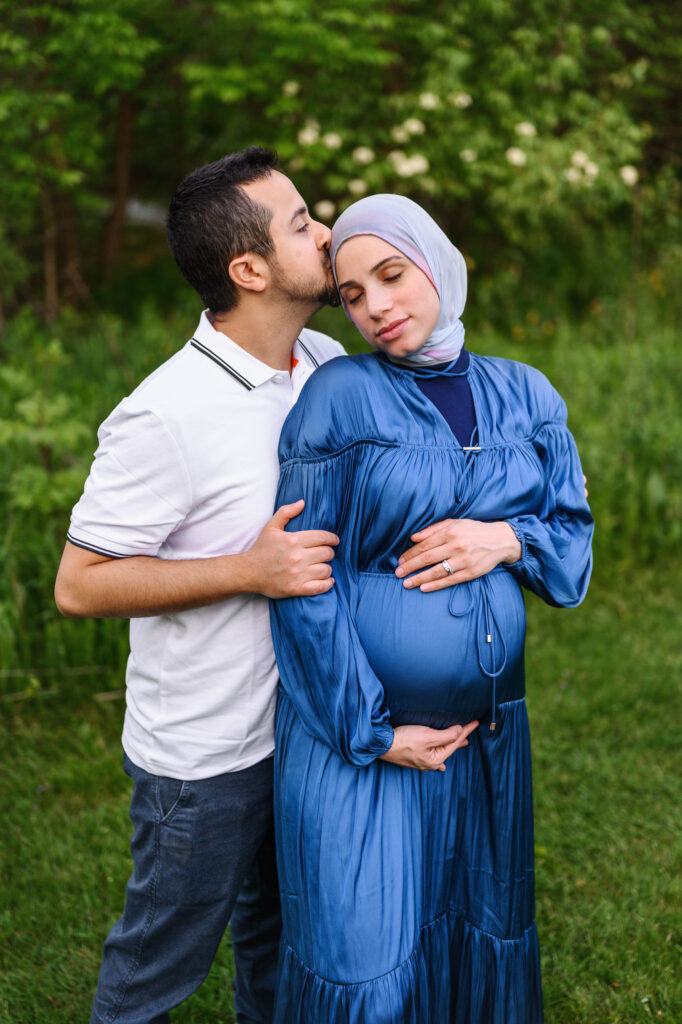 Mom and Dad to bee snuggling during their Grand Rapids maternity session