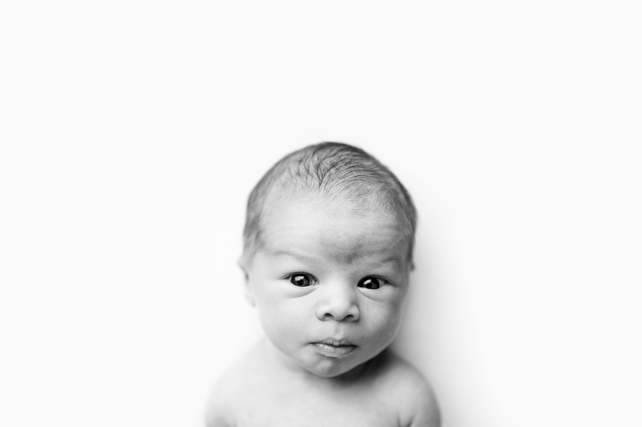 Black-and-white close-up of a newborn baby in Grand Rapids, Michigan