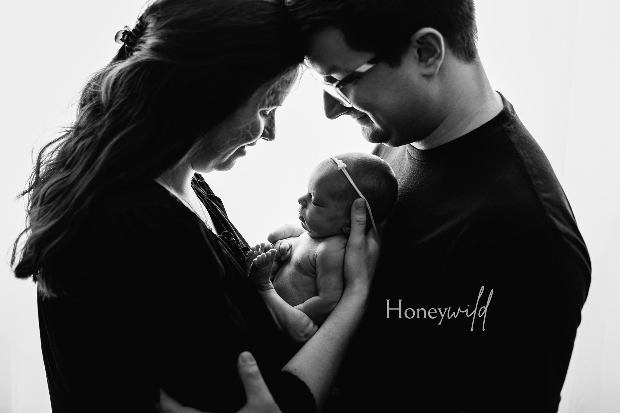 A timeless black-and-white newborn portrait taken at a Grand Rapids photography studio