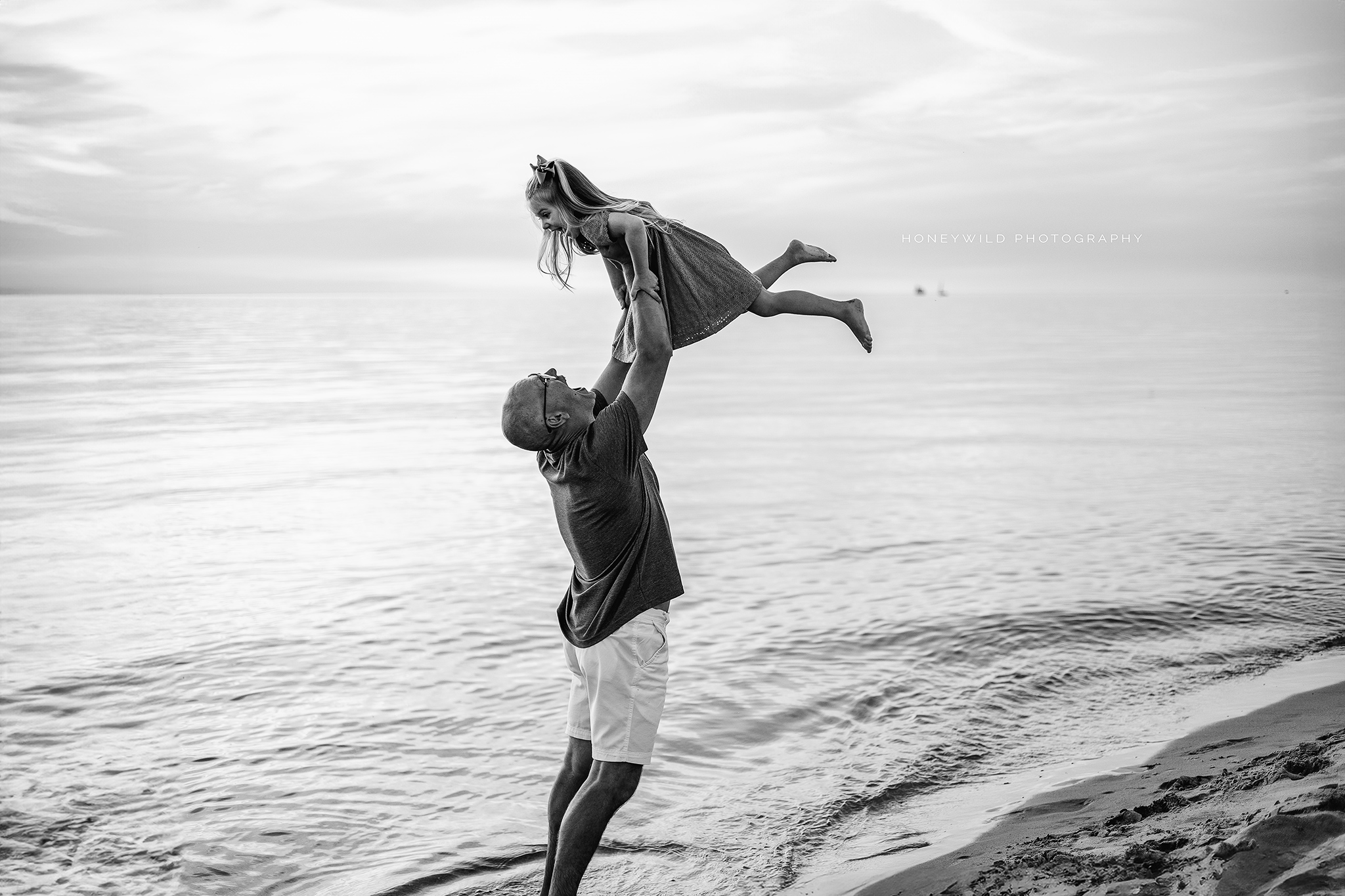 Grand Rapids family photographer capturing joyful outdoor and beach family photoshoots. Cherished family memories in West Michigan, perfect for candid and playful family portraits