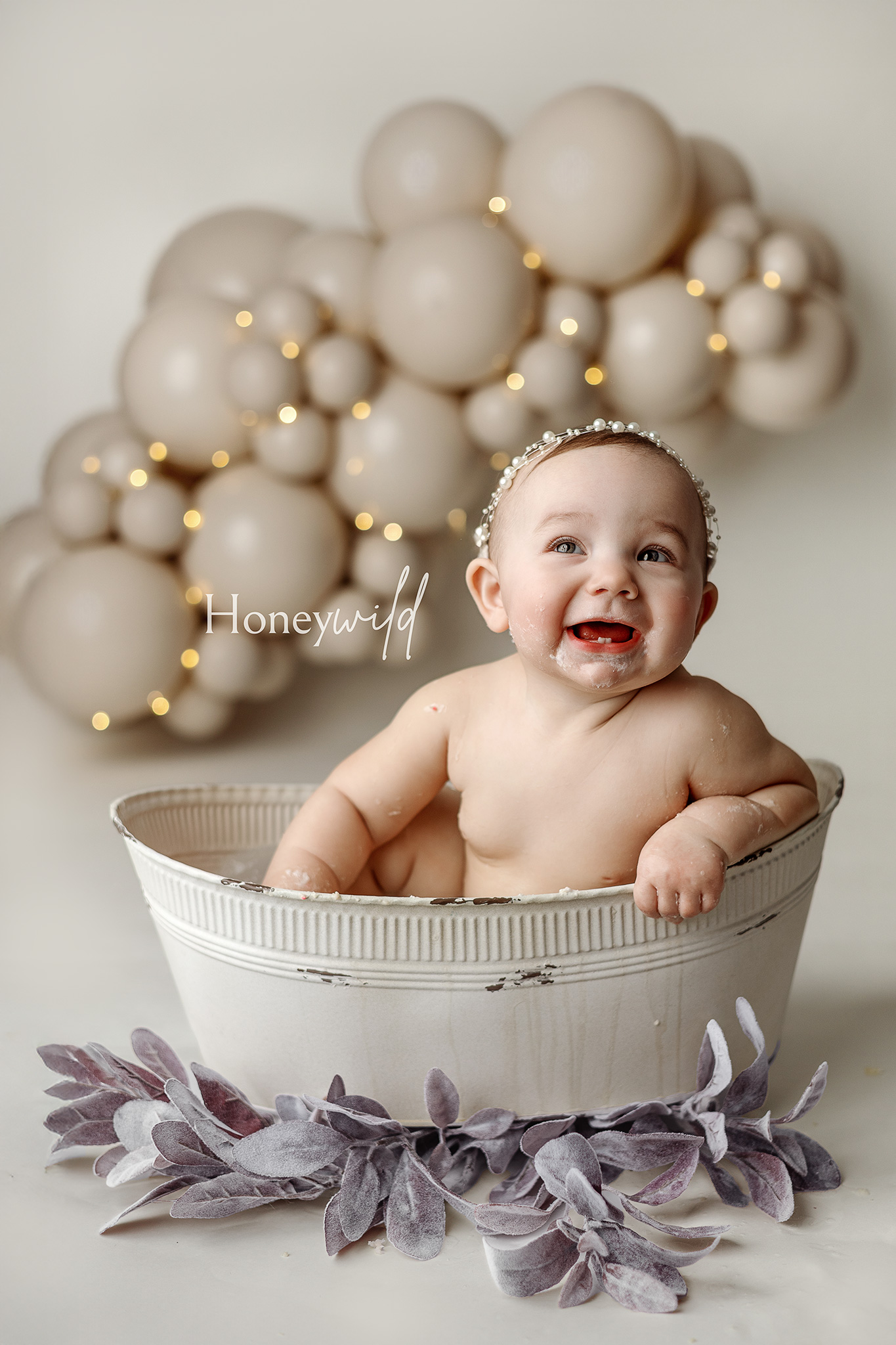 Milestone baby photography by a Grand Rapids newborn photographer featuring a sitter baby in a neutral studio setup