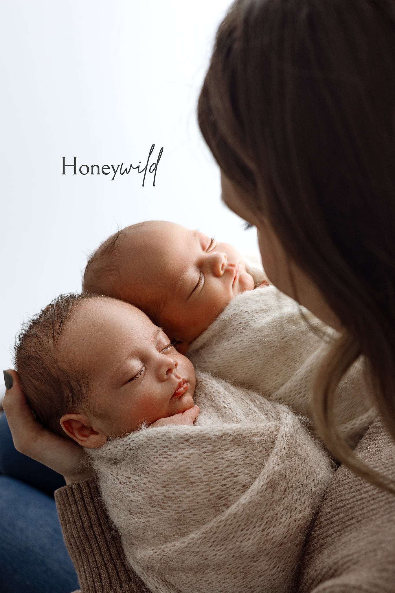Newborn baby posed safely in professional photography studio