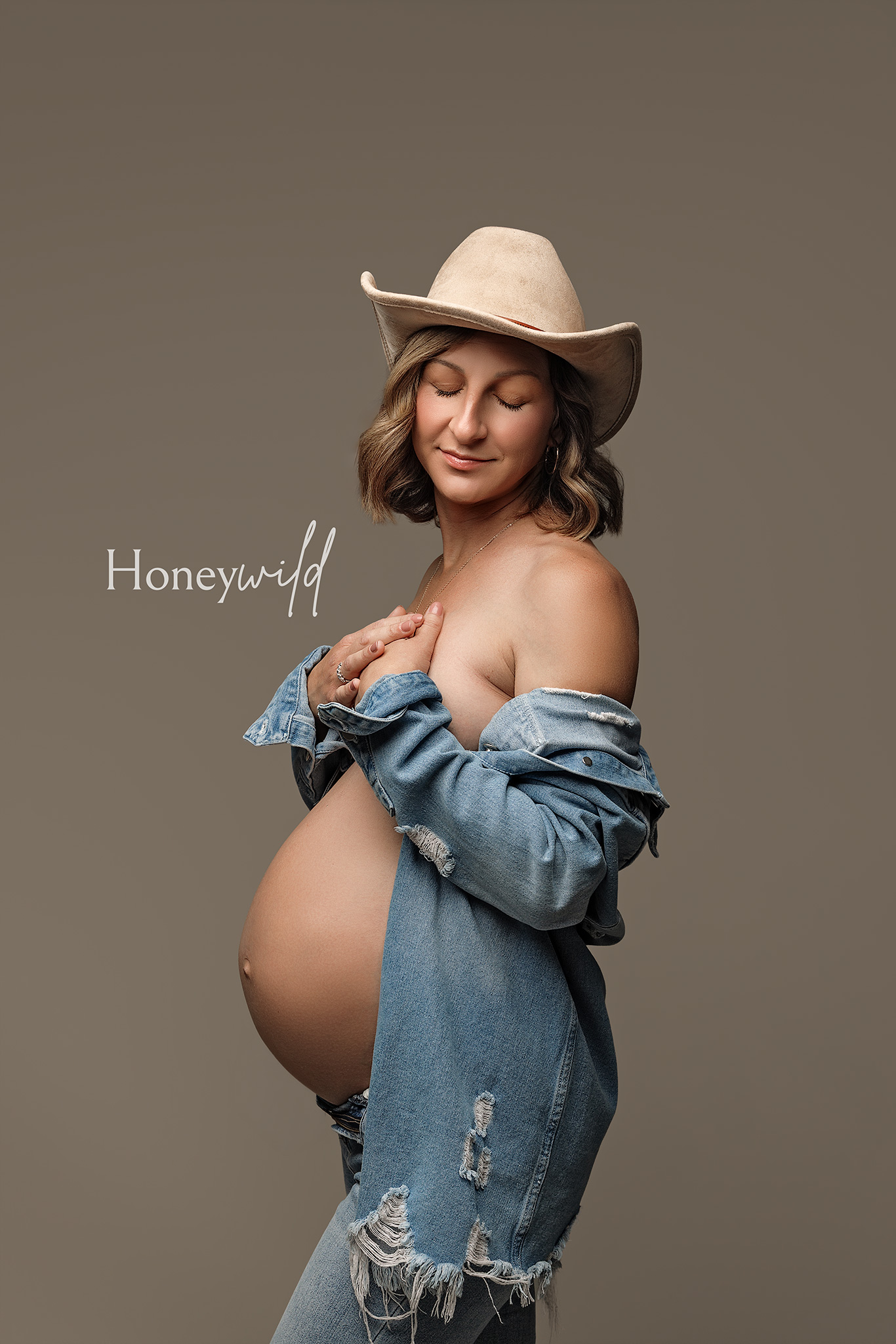 Editorial maternity photography Grand Rapids studio, denim styling